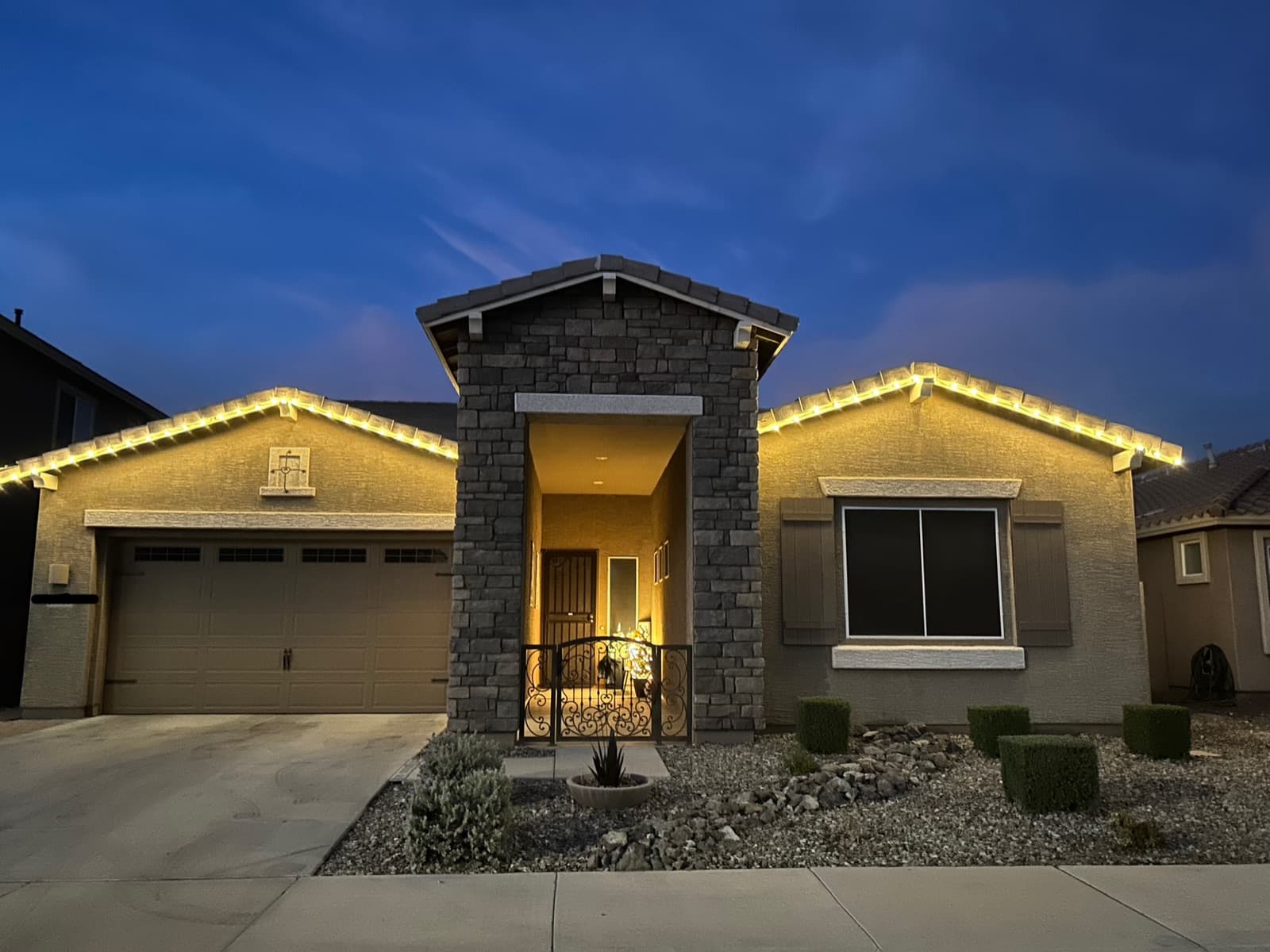 Holiday light installation on a Valley home